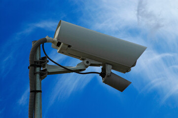 image of a security camera with the sky in the background