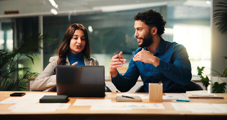 Collaboration, explain and laptop with business people in office together for meeting or planning. Computer, ideas and strategy with happy employee team at desk in workplace for problem solving