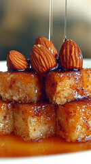 Sweet dessert pieces with almonds and drizzling honey. Delicious golden sticky pastries.