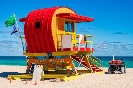 Miami pier. Jetty lifeguard tower on Miami Beach. Scenic view of Miami Beach coastline. Famous South Beach lifeguard. Tropical paradise in Miami. Art Deco lifeguard on Miamis beach. - Powered by Adobe