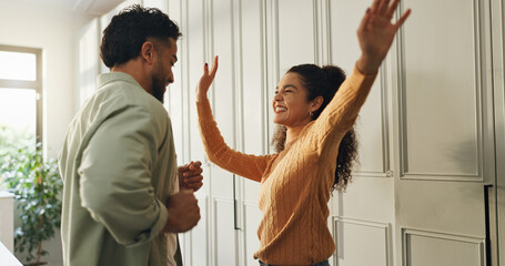 Dancing, couple and fun in new home, laughing and celebration for milestone in kitchen or...