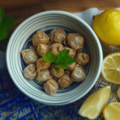 Delicious stuffed grape leaves, known as dolmas, are artfully arranged in a bowl. Fresh lemons accompany this classic Mediterranean dish.