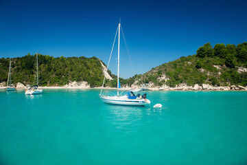 Sailboat Anchored in Turquoise Bay