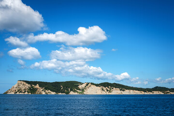 Scenic Coastal Landscape with Rocky Cliffs and Blue Sky
