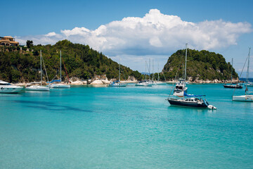 Serene Coastal Scene with Sailboats and Turquoise Waters