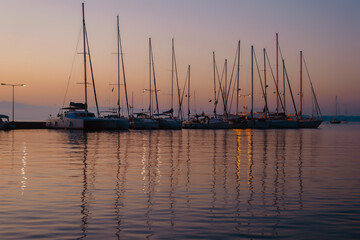 Sailboats at Sunset in a Tranquil Marina