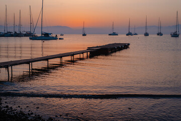 Sunset Serenity with Sailboats and Pier