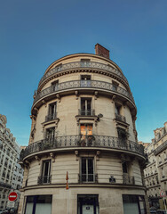 Unique round building with iron balconies in Paris, France.