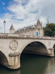 Beautiful stone bridge crossing River Seine in Paris, France.