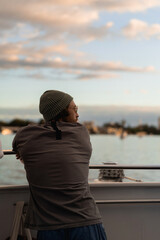 Man with beard and tattoos on ferries at sunset, Brisbane transport