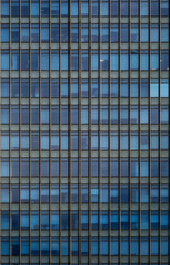 Obraz premium Windows of Modern Office Building. Glass building skyscraper texture in Shanghai, China