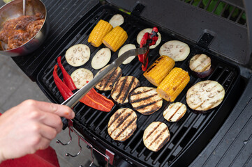 Grilled vegetables on barbecue with bell peppers and corn on the cob