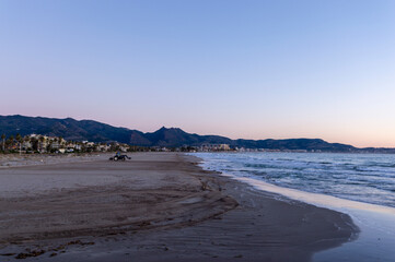 tractor working on the cleaning and maintenance of the beaches of the Mediterranean coast.