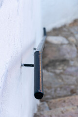 metal railing anchored to the wall