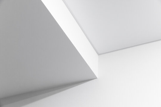 Angular white walls create a minimalist abstract composition