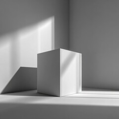 Fototapeta premium Simple white cube product display in a sunlit room
