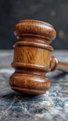 Wooden gavel on dark surface (2)