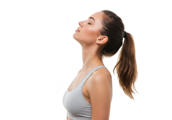 A fit woman with a ponytail in a gray sports bra, eyes closed and head tilted back, isolated on a transparent background