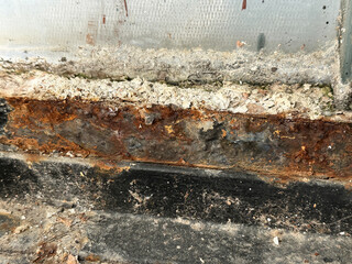 Close-up of a rusty dirty part of an old building