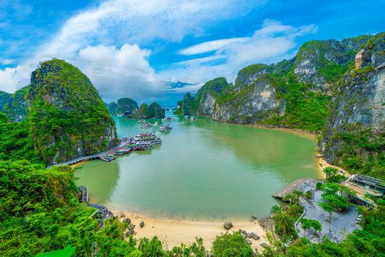 Panorama view from the Sung Sot Cave, also known as Surprise Grotto, is indeed located on Bo Hon Island in Ha Long Bay with blue sky sunny day.