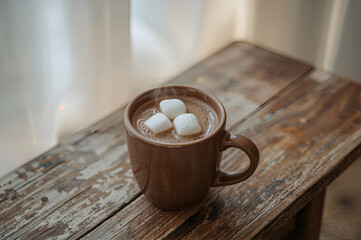 Hot Cocoa with Marshmallows on a Rustic Wooden Surface