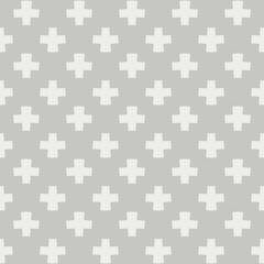 A repeating pattern of white cross shapes is positioned against a light gray background, creating a simple yet modern design. The arrangement of crosses is uniform and consistent.