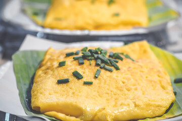 Golden Vietnamese Omelette: Stuffed Crispy Delight on Banana Leaf.