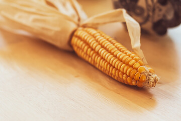 Golden Ear of Corn: Nature's Sweet Harvest on Wood.