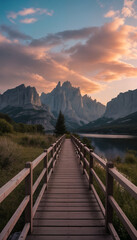 Fototapeta premium Scenic wooden walkway leading to mountains during sunset 