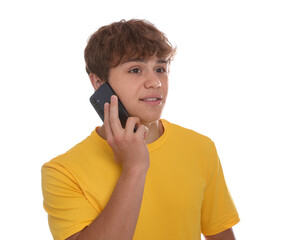 Smiling teenage boy talking by smartphone on white background