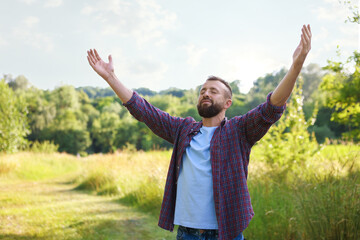 Feeling freedom. Man enjoying time outdoors. Space for text