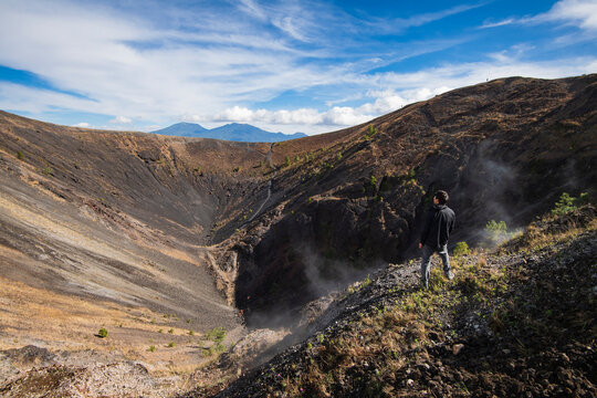 One man standing at the summit of the crater of Paricutin volcano