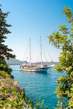 A traditional Turkish gulet anchored in a naturally beautiful bay in Kas, Antalya