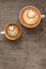  a cup of latte art coffee on wooden background                                                                                                                                                         