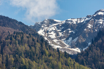 The mountains are covered in snow and the sky is clear