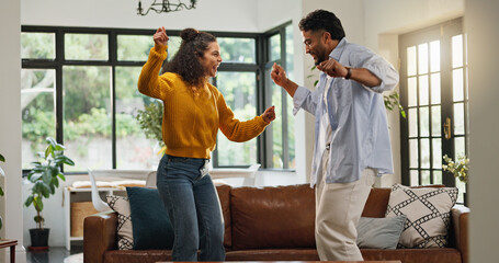 Happy couple, dancing and bonding in living room, home and love with celebration for goals. People, man and woman with moving, rhythm and playful smile for partnership, relationship or care in house