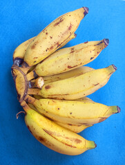 A bunch of ripe yellow bananas. Healthy tropical fruit cluster. Fresh organic natural diet food.