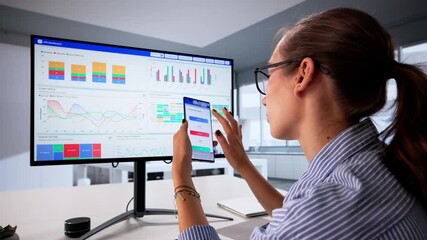 Female Data Analyst Examining KPI Analytics - Powered by Adobe
