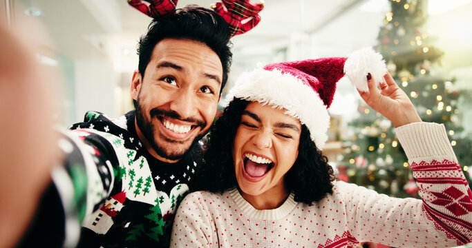 Happy, couple and selfie for Christmas in home, memory and celebration for December holiday or love. Bonding, man and woman with smile for profile picture POV, festive season and photography in house - Powered by Adobe