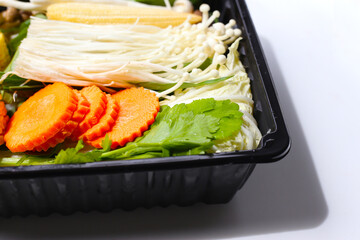A fresh mix of vegetables prepared for suki or hot pot cooking.