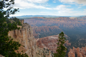 Family hiking in red mountains in Utah on summer vacation. Friends hiking Fairyland Loop Trail . Bryce Canyon National Park, Utah, USA.