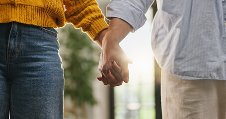 Love, holding hands and trust with couple in house for romantic connection, support and care....