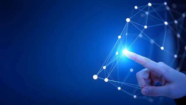 Touching a digital network, a hand interacts with a modern abstract futuristic connection system over a glowing blue background.