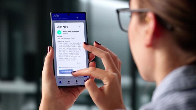 Close-up Of A Hand Holding Mobile Phone Showing Job Search Engine