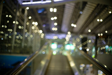 Bokeh of unfocused lights near the escalator in the airport