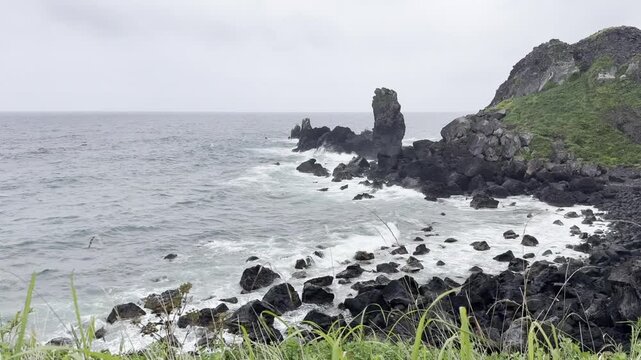 Waves at a rocky beach with sea stacks