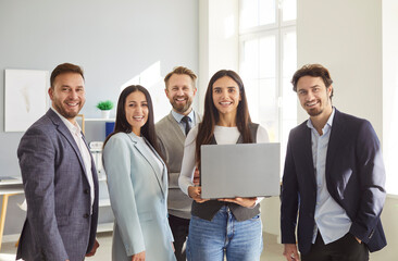 Successful smiling happy diverse professional business team standing in office looking at camera, workers staff group, pose together human resource, corporate company portrait, corporate teambuilding