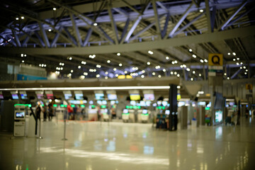 Airport ticket machines and check-in counters (blurred background, defocused)