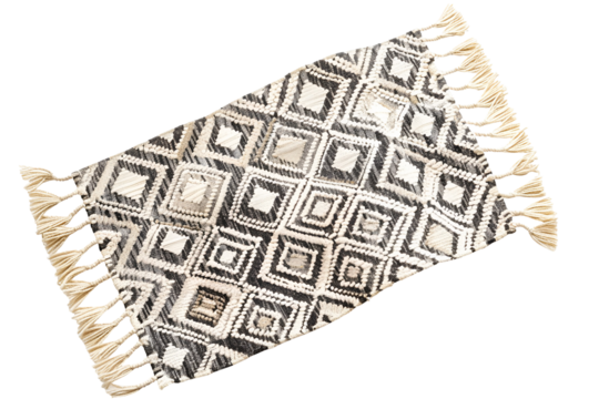 Black and white patterned rug with tassels