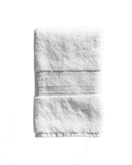 White towel neatly folded on a clean surface backdrop